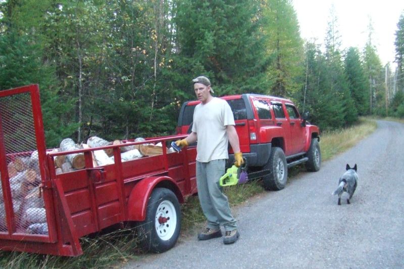 Cowboy and I cutting firewood, he is launching to chase something