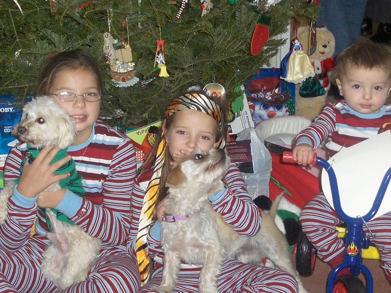 Me and my younger sister and younger brother. Lucky in the green sweater, kisses sitting with her mommy.